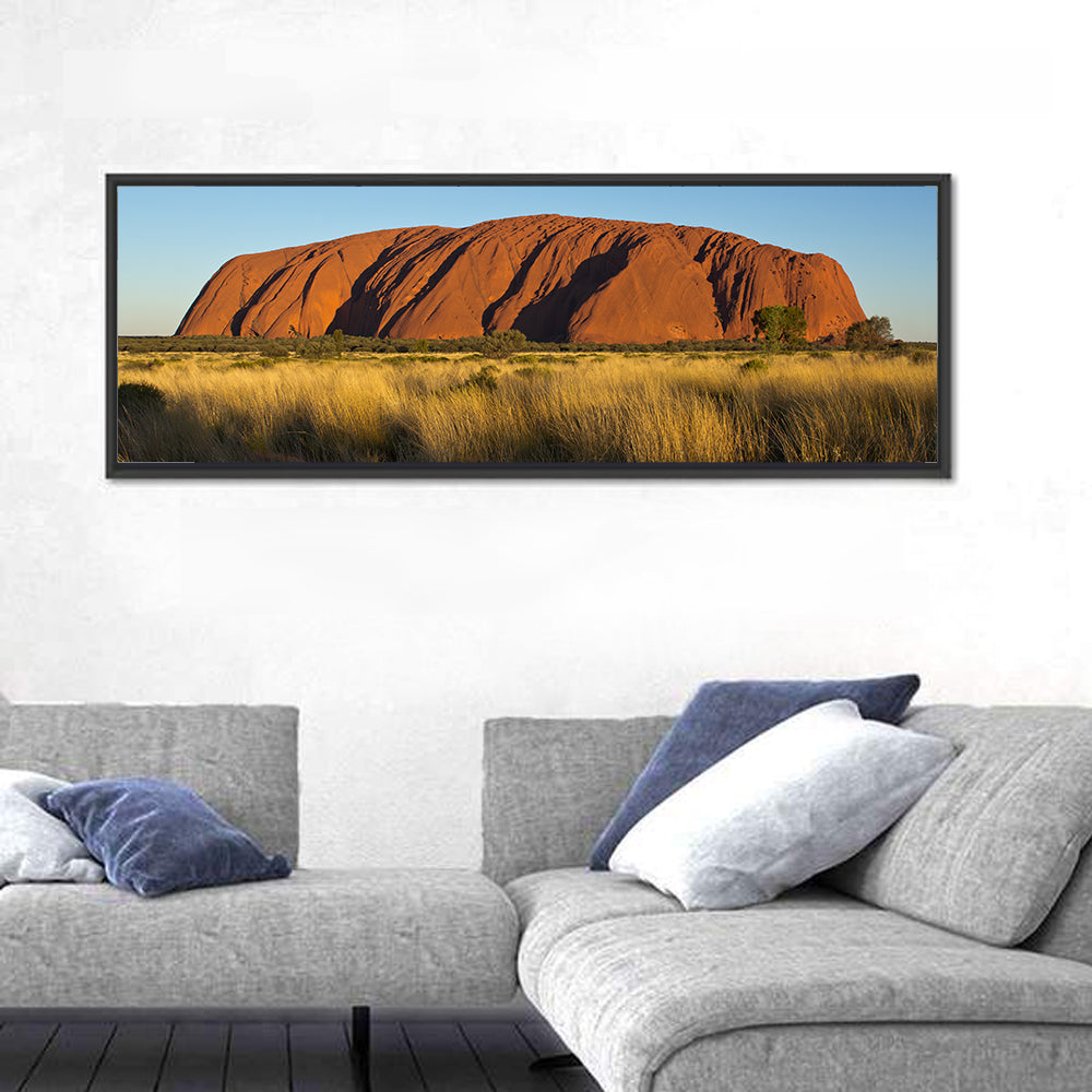 Uluru Red Rock at Golden Hour Wall Art in a room, panoramic