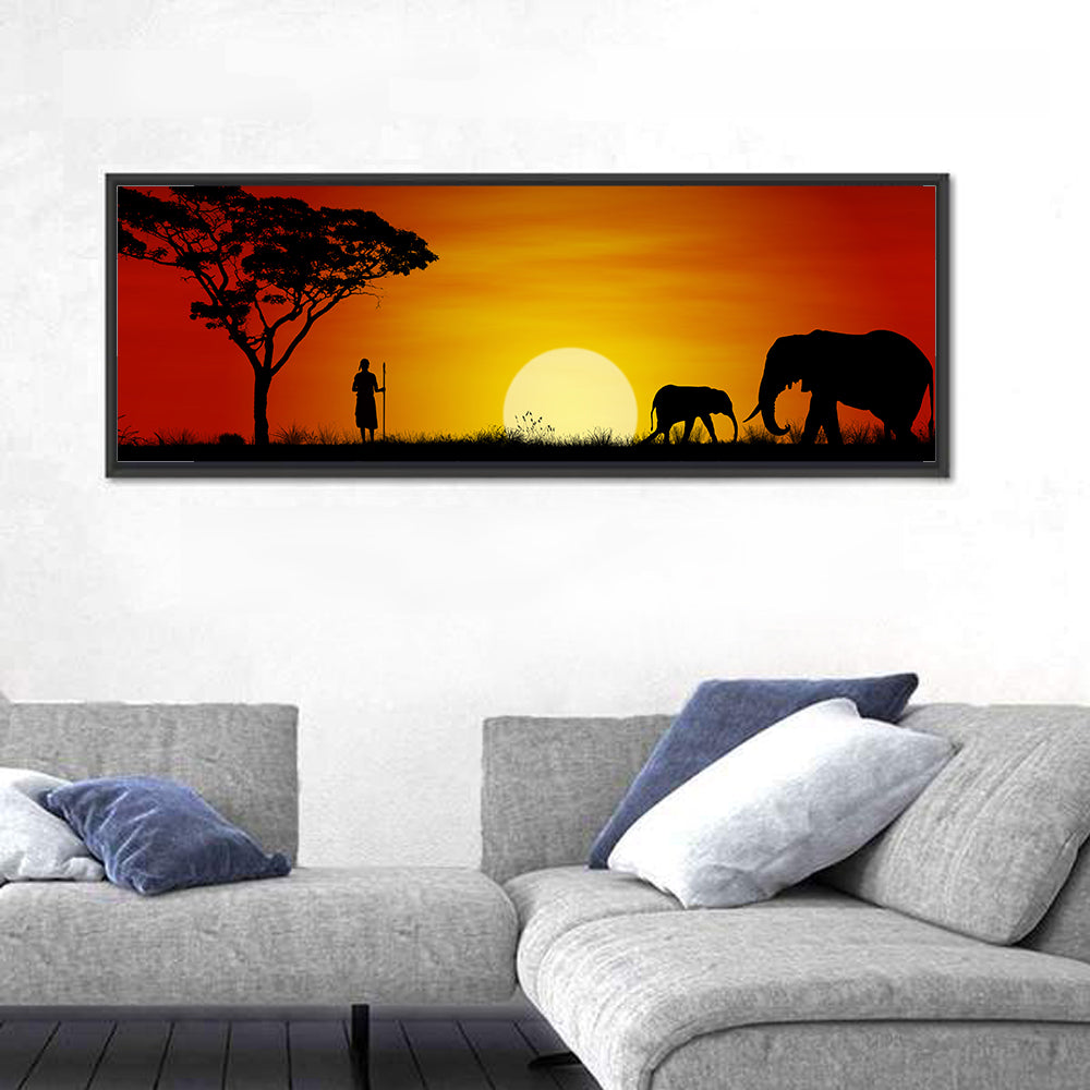 Massai Warrior and Elephants at Sunset Wall Art in a room, panoramic
