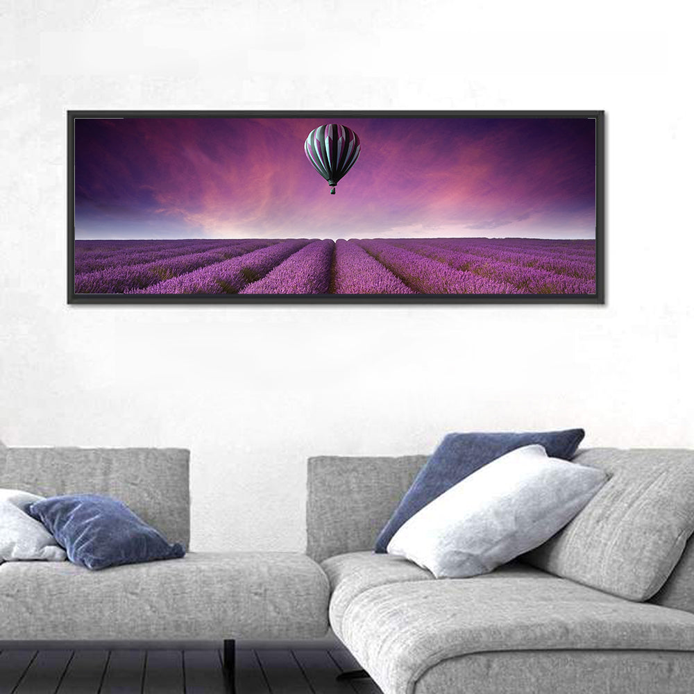 Hot Air Balloon Over Lavender Field Wall Art in a room, panoramic