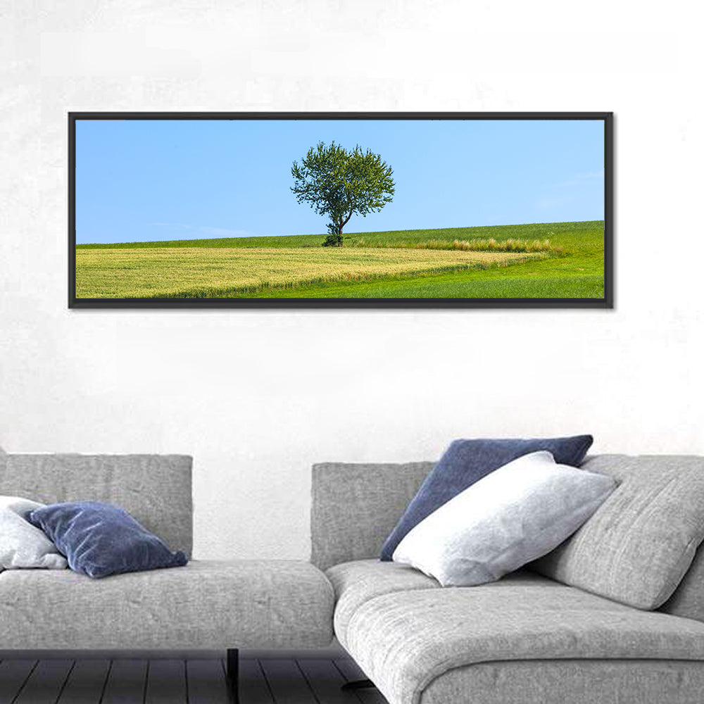 Solitary Tree on Rolling Meadow Wall Art in a room, panoramic