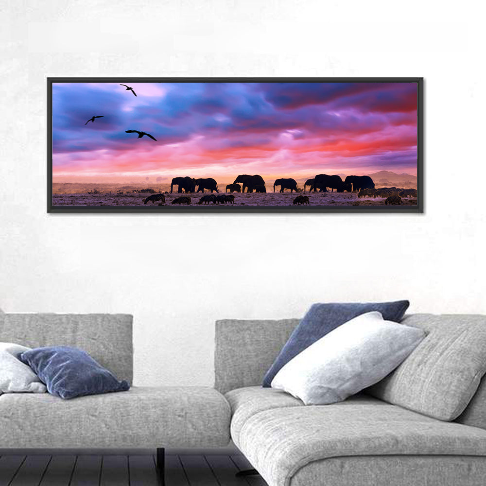 Elephants at Savannah Sunset Wall Art in a room, panoramic