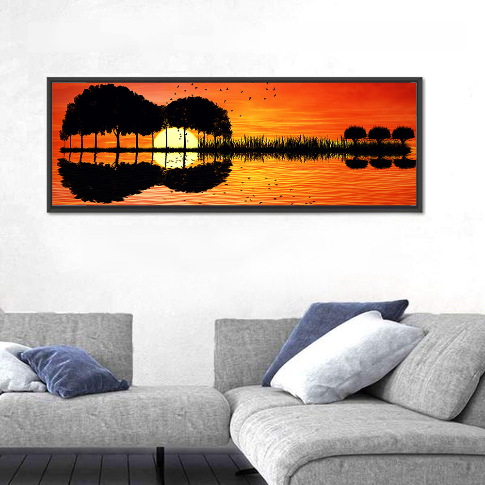 Sunset Trees and Lake Reflection Wall Art in a room, panoramic
