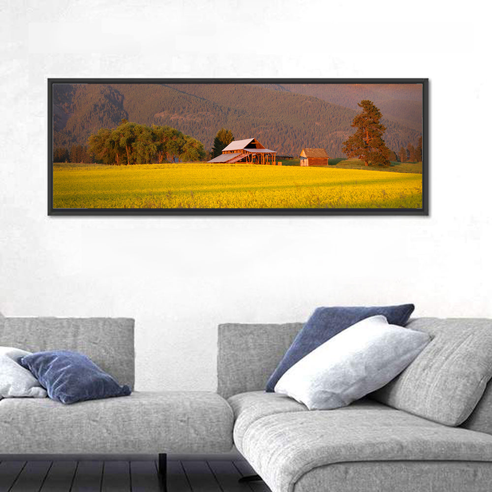 Rapeseed Field and Barn at Golden Hour Wall Art in a room, panoramic
