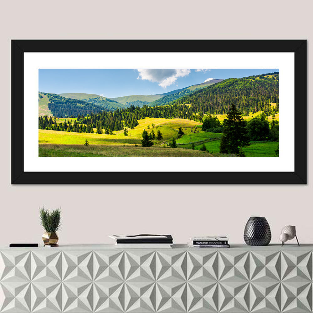 Sunlit Haystacks on Rolling Grassy Hills Wall Art in a room, panoramic