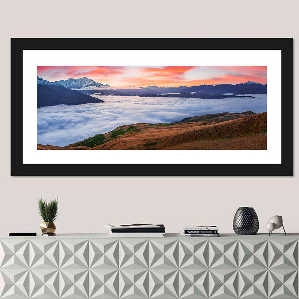 Mt Tetnuld Sunrise Over Clouds Wall Art in a room, panoramic