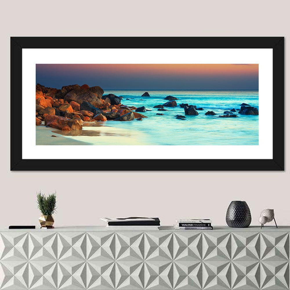 Sunset Over Volcanic Shoreline Wall Art in a room, panoramic
