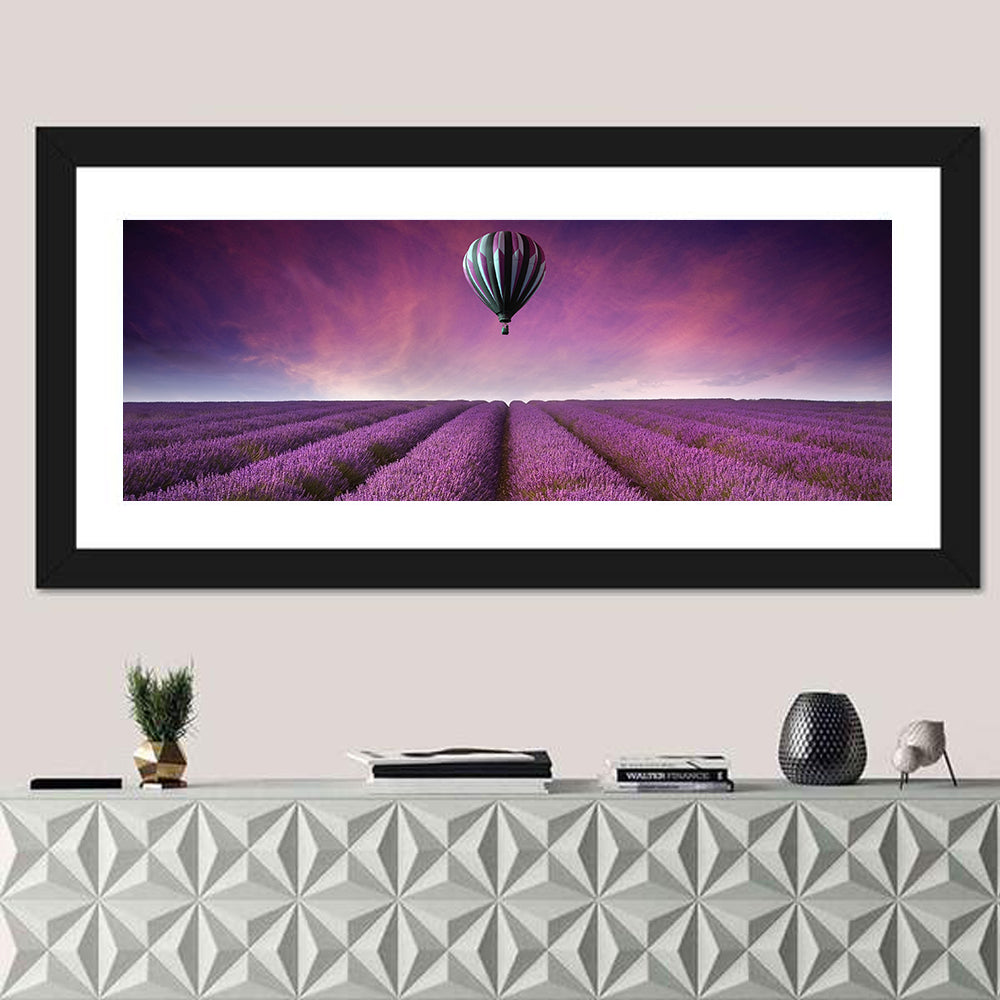Hot Air Balloon Over Lavender Field Wall Art in a room, panoramic