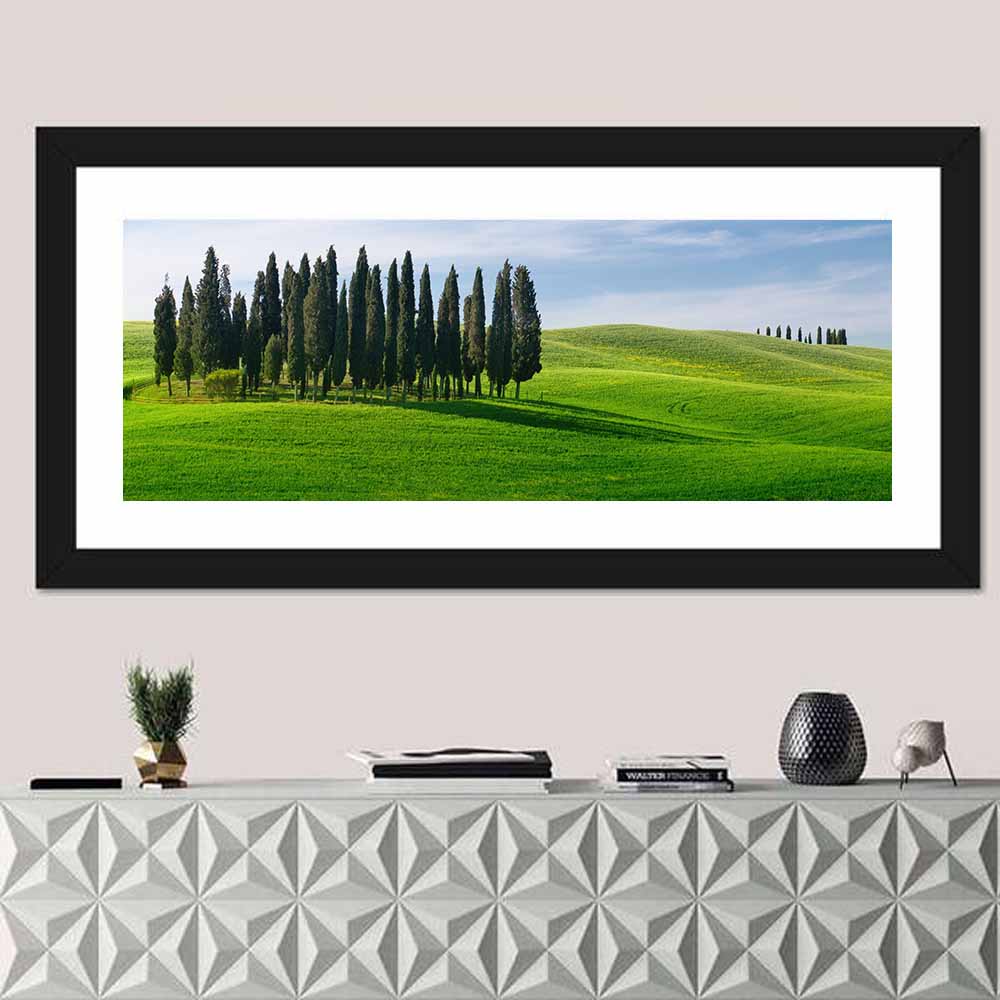 Tuscany Rolling Hills with Cypresses Wall Art in a room, panoramic