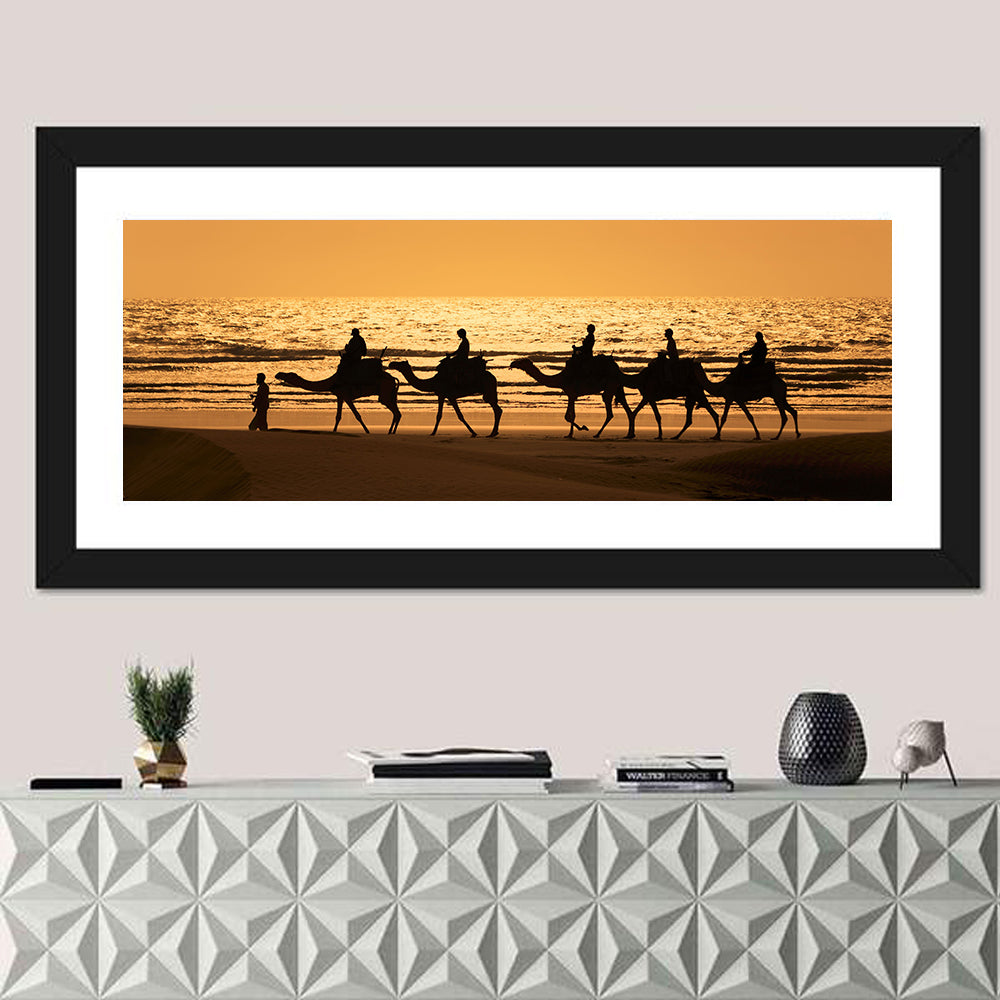 Camel Caravan at Sunset Wall Art in a room, panoramic