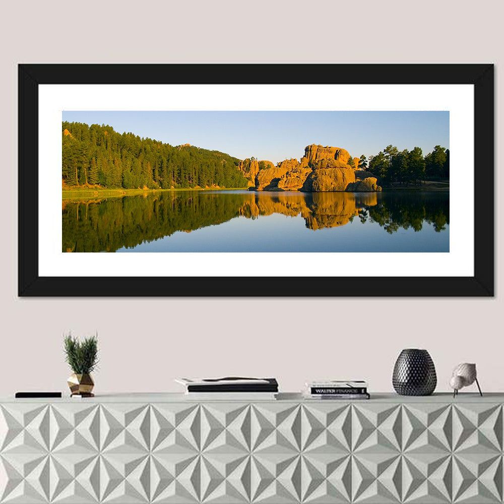 Sylvan Lake Golden Hour Reflection Wall Art in a room, panoramic