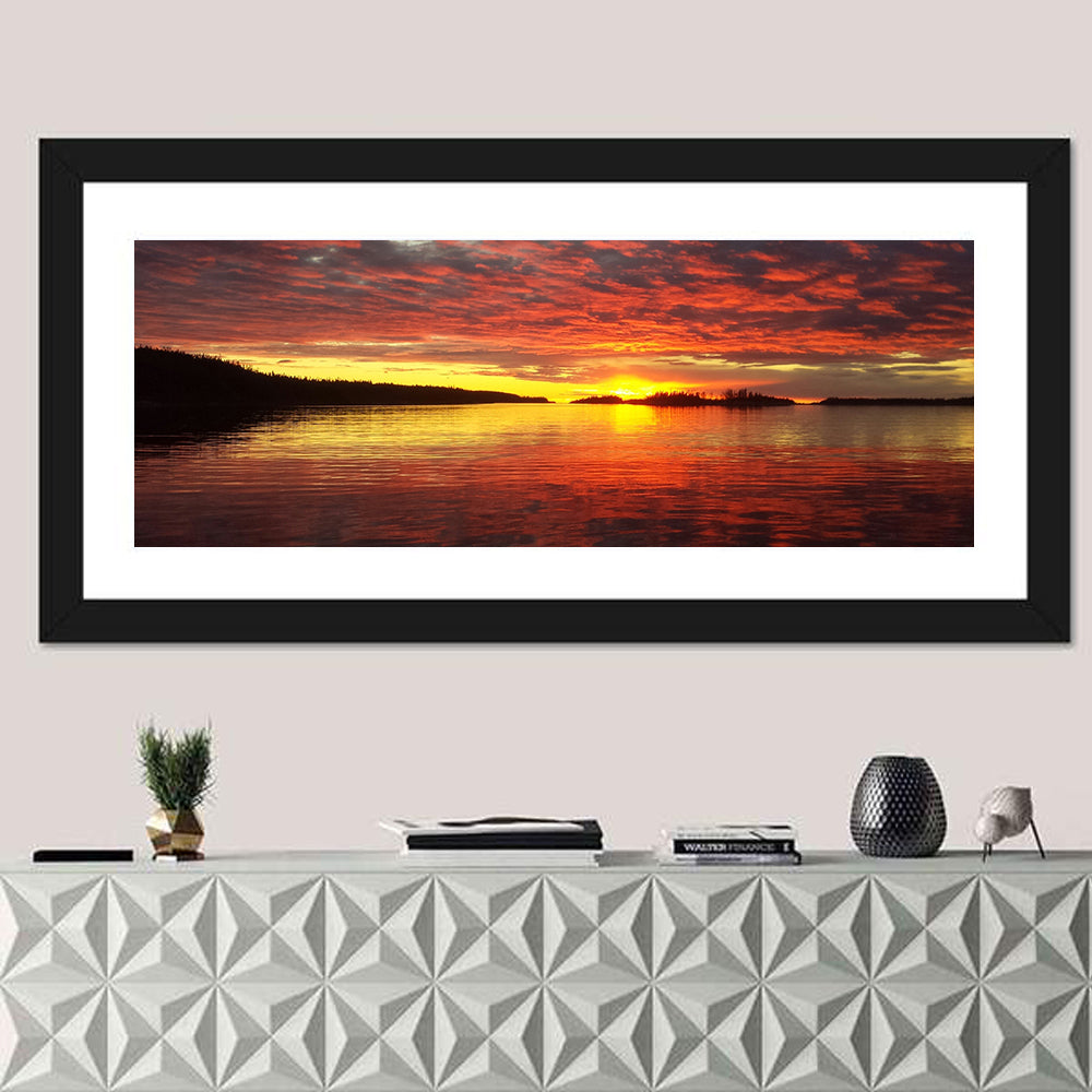 Lake Athabasca Sunset Reflection Wall Art in a room, panoramic
