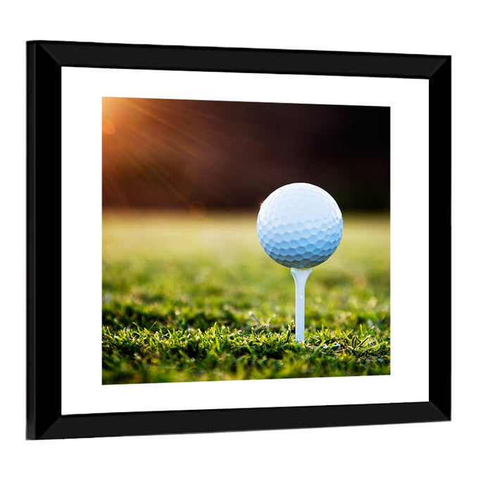 Golf Ball on Tee at Sunset Wall Art as a framed print