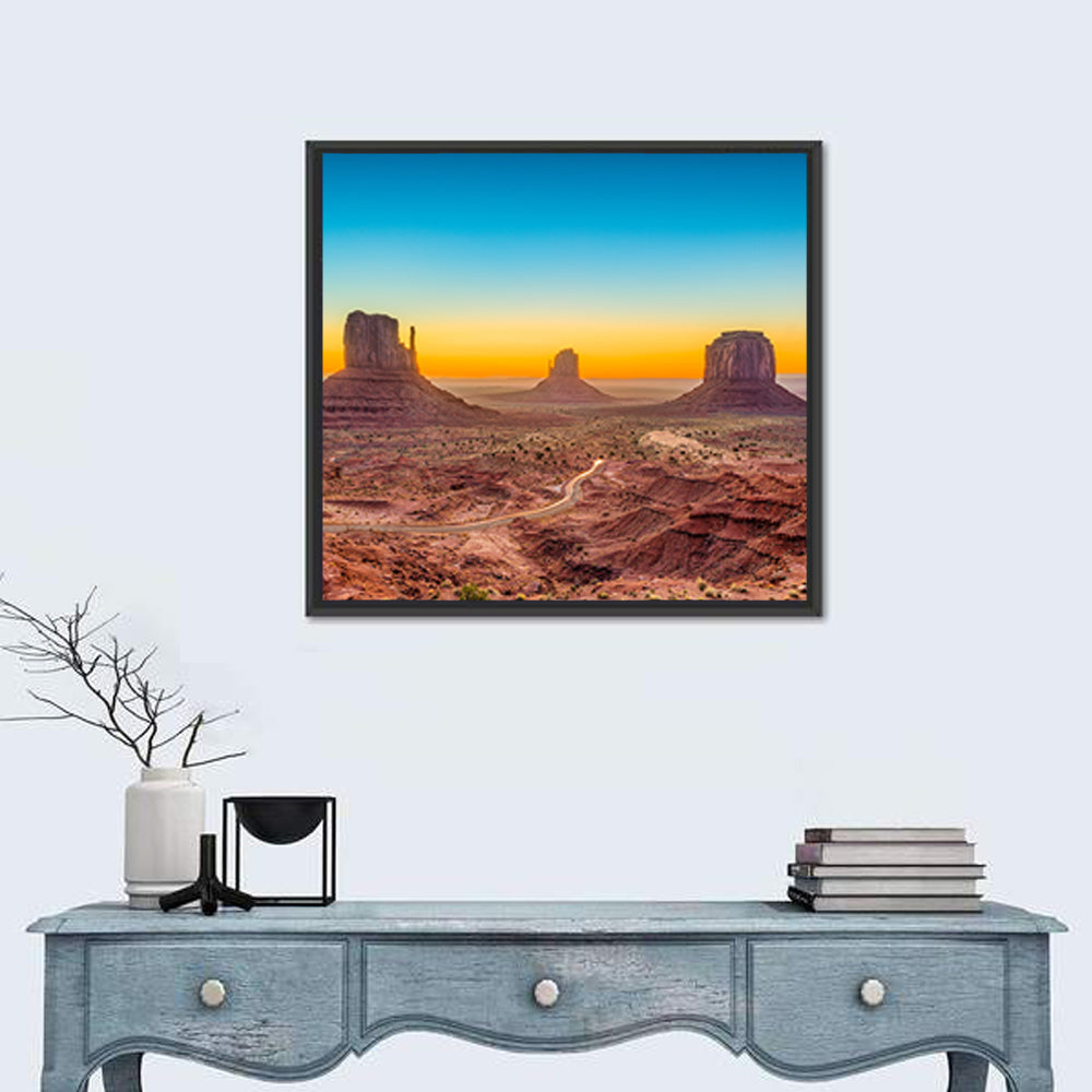 Monument Valley Sunrise with Winding Road Wall Art in a room, square