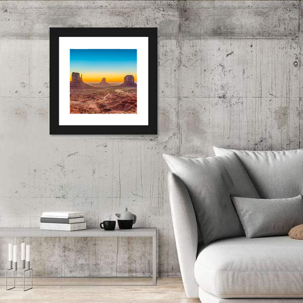 Monument Valley Sunrise with Winding Road Wall Art in a room, square