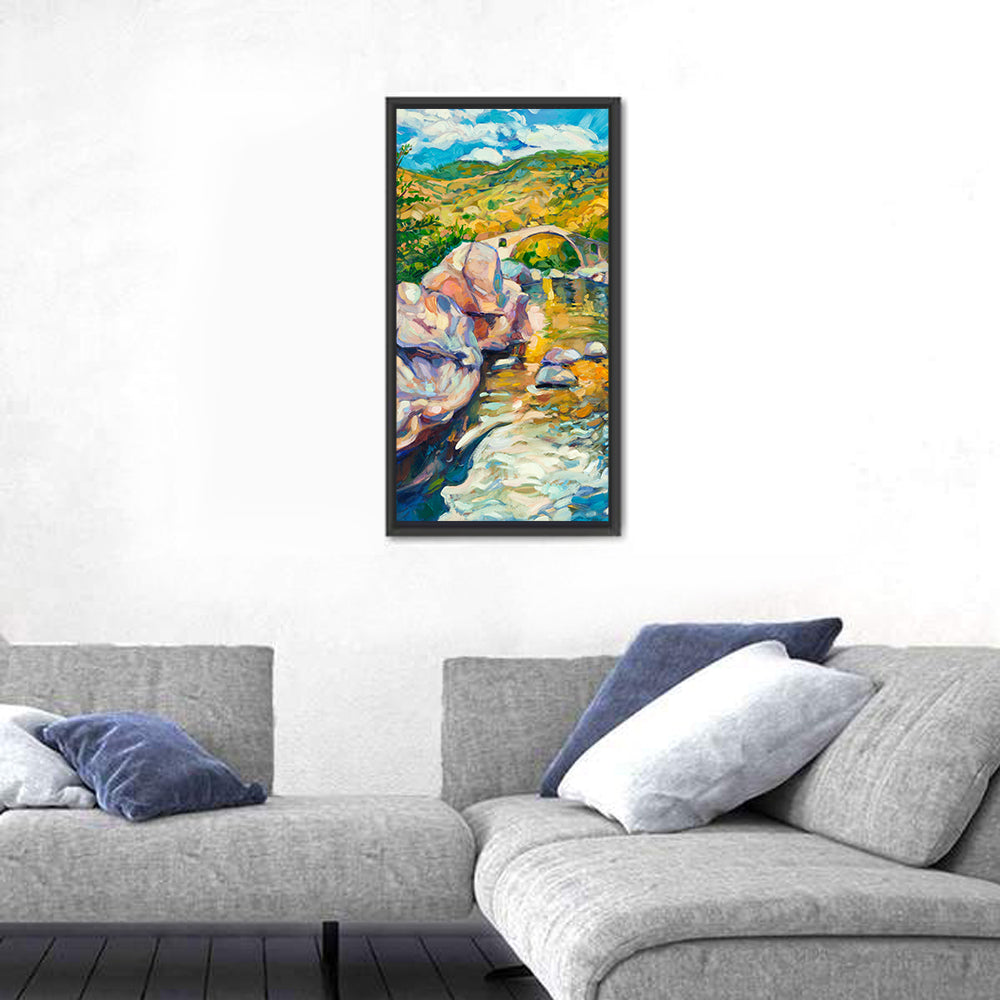 Arched Stone Bridge in Mountain River Wall Art in a room, portrait