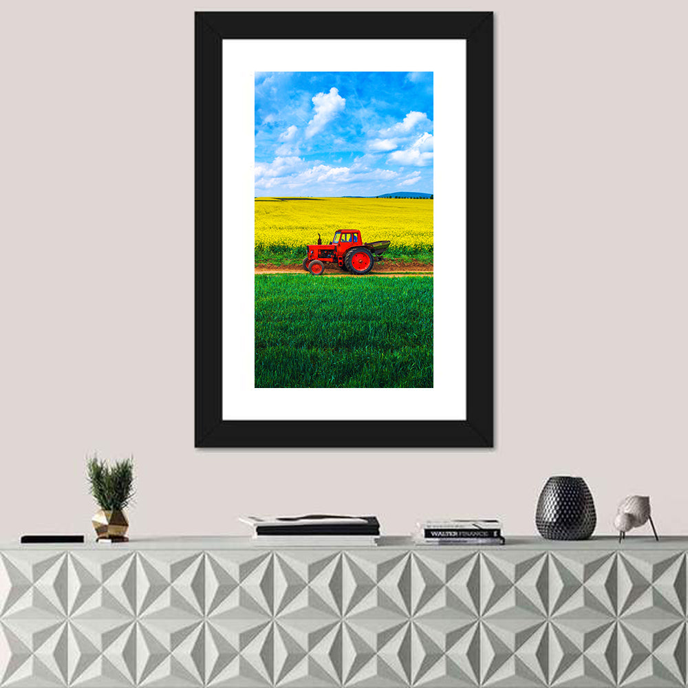 Red Tractor Over Yellow Rapeseed Field Wall Art in a room, portrait
