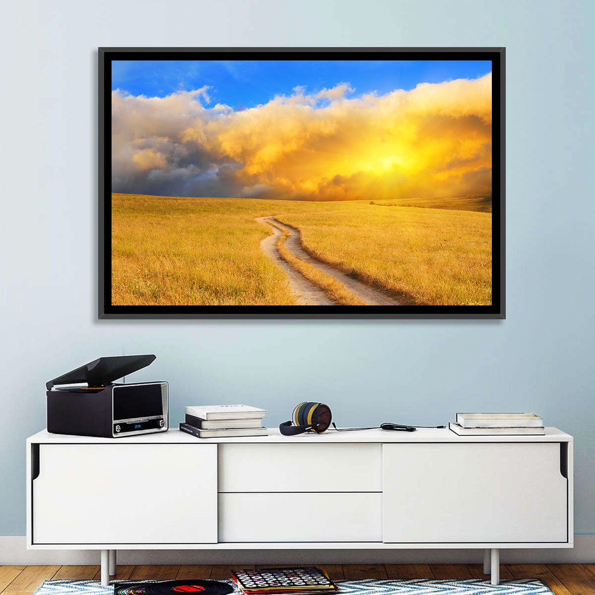 Sunlit Meadow Path with Dramatic Clouds Wall Art in a room, landscape