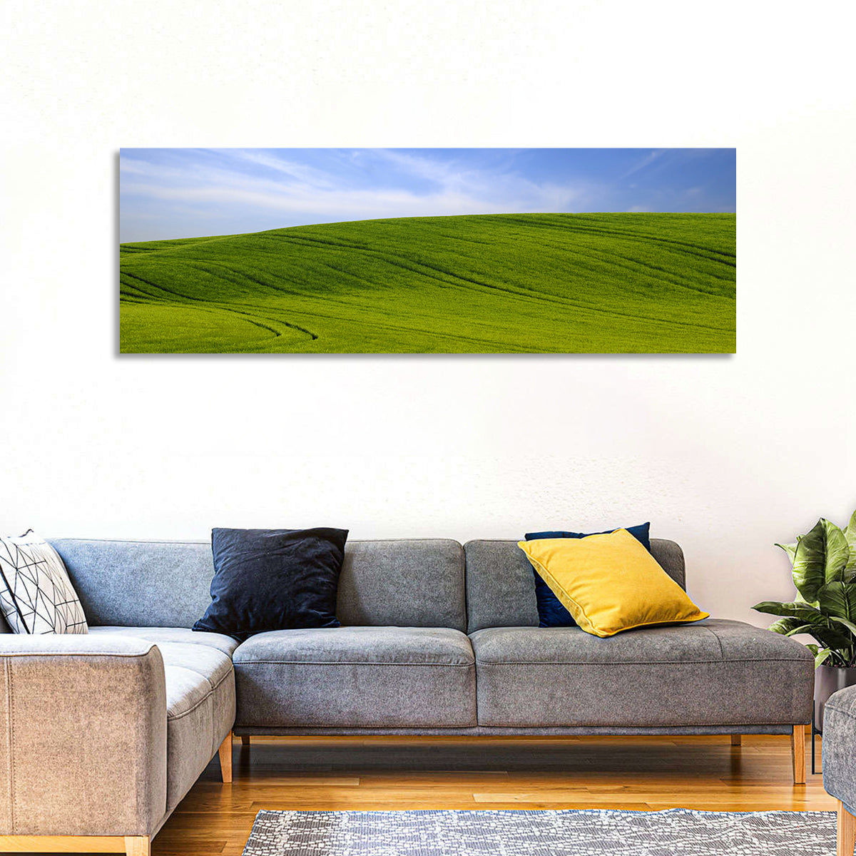 Rolling Green Hill with Blue Sky Wall Art in a room, panoramic
