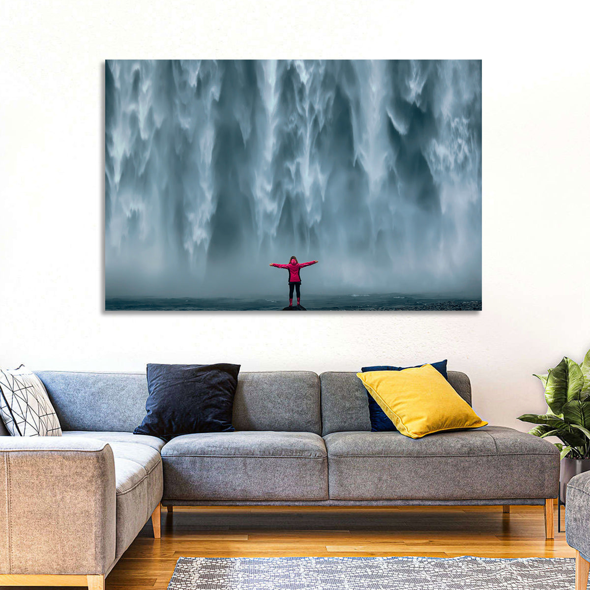 Skogafoss Waterfall with Figure in Pink Wall Art in a room, landscape