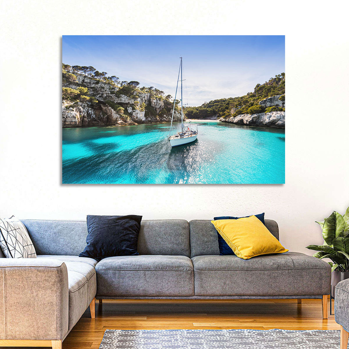 Menorca Cove Sailboat Wall Art in a room, landscape