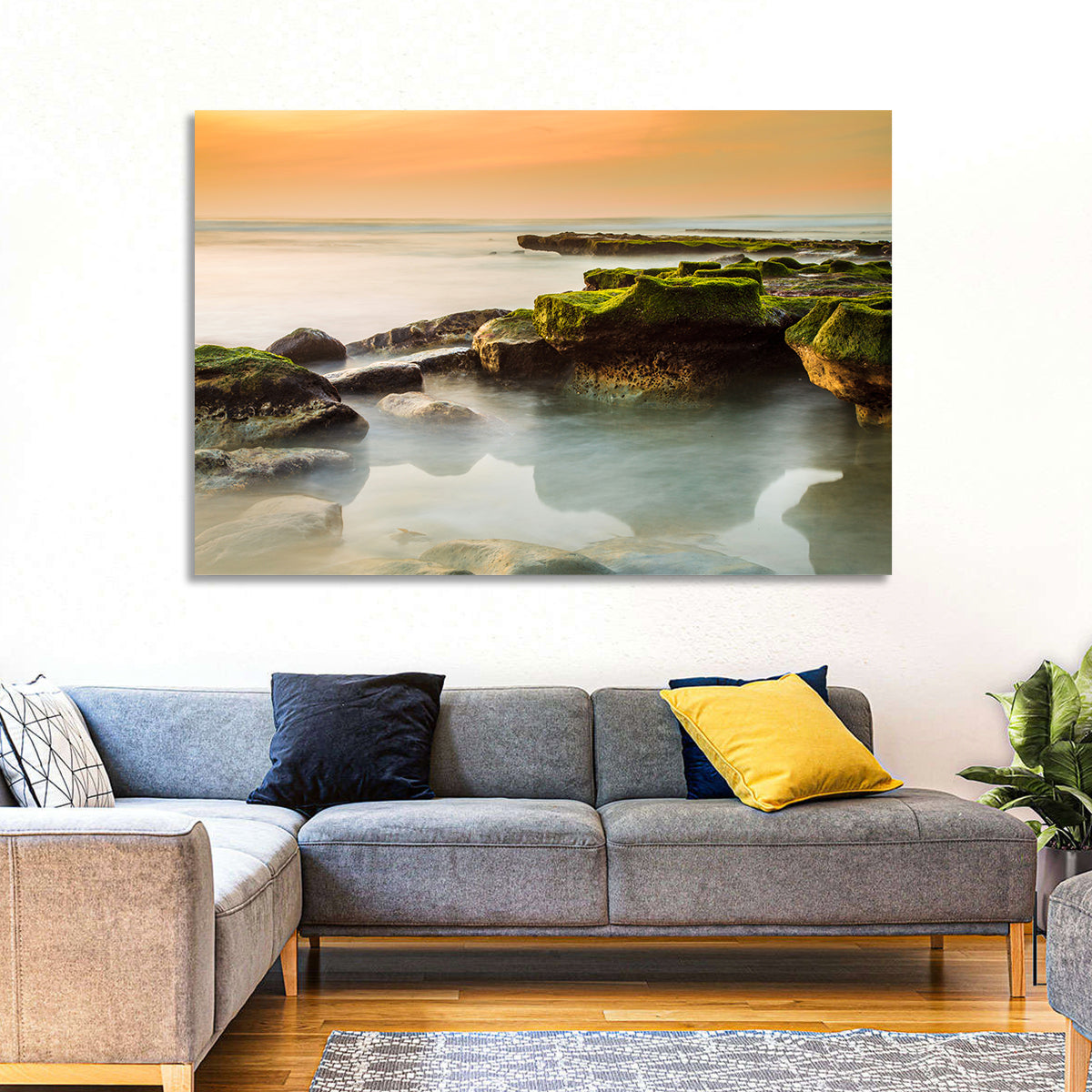 Mossy Rocky Coastline at Golden Hour Wall Art in a room, landscape