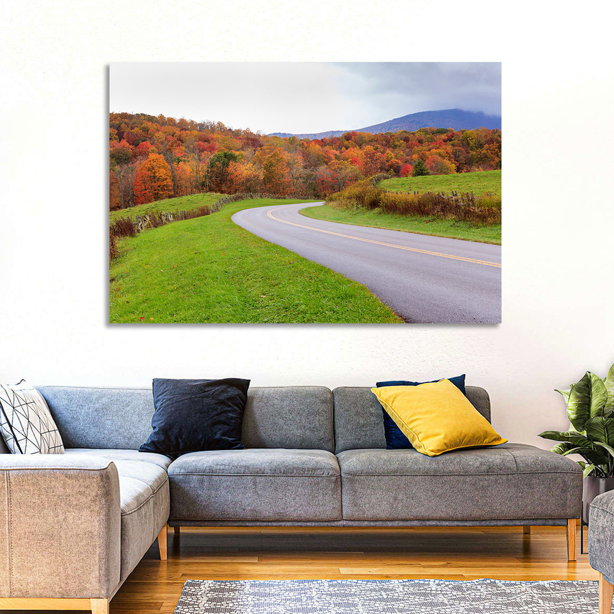 Curving Road Through Autumn Meadow Wall Art in a room, landscape