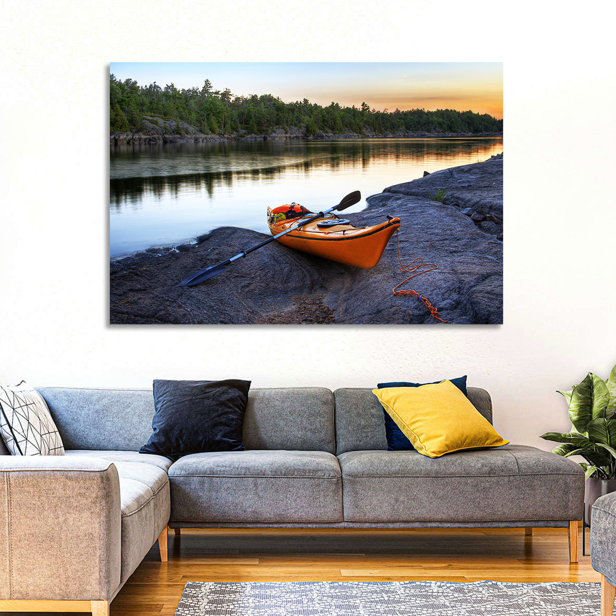 Orange Kayak on Rocky Shore Wall Art in a room, landscape