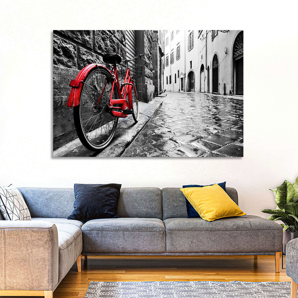 Red Bicycle on Rainy Cobblestone Street Wall Art