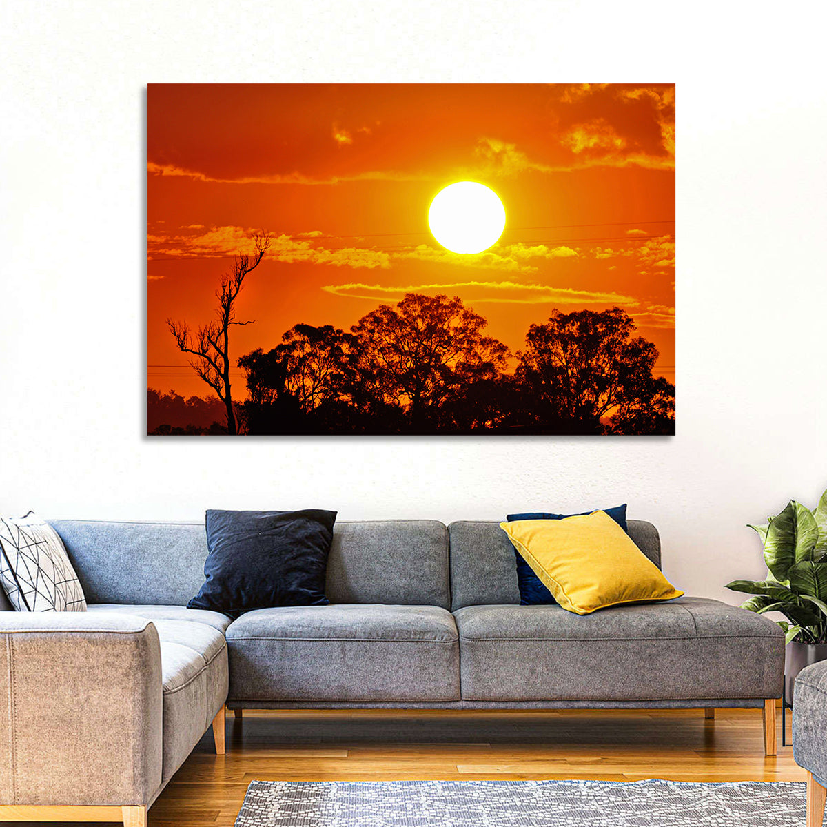 Burning Sun Over Tree Silhouettes Wall Art in a room, landscape