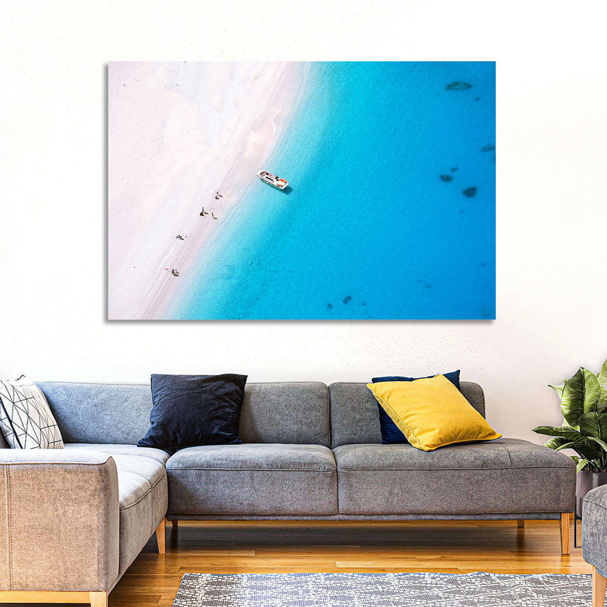 Aerial Beach Bay with White Boat Wall Art in a room, landscape