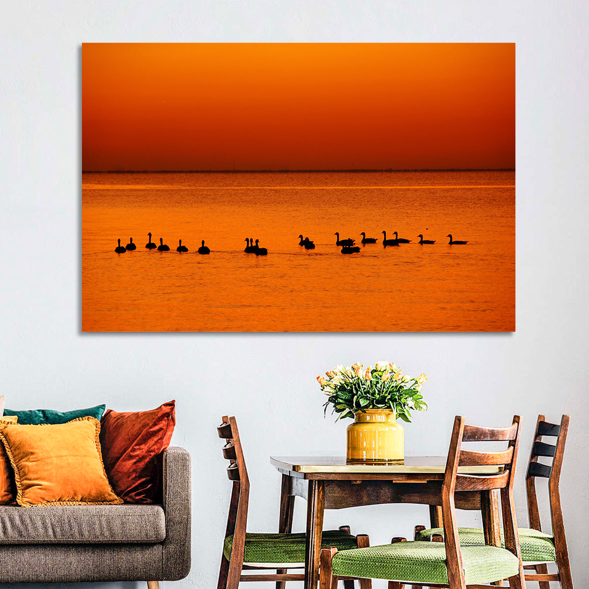 Geese Silhouettes at Orange Sunset Wall Art in a room, landscape