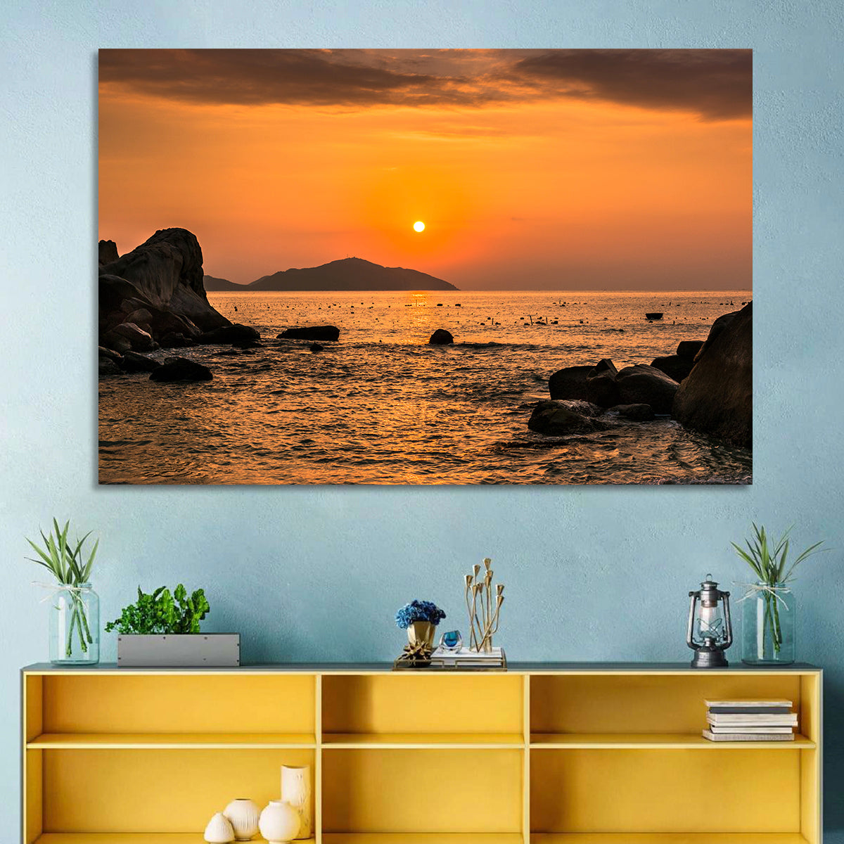 Orange Sunrise Over Rocky Coast Wall Art in a room, landscape