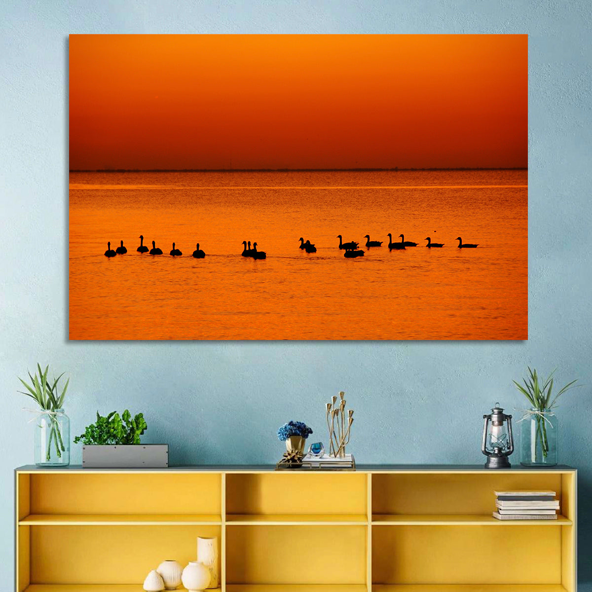 Geese Silhouettes at Orange Sunset Wall Art in a room, landscape