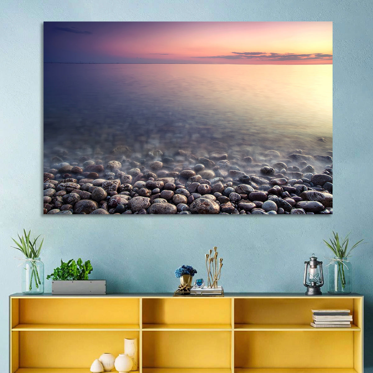 Pebbled Shore Sunset Wall Art in a room, landscape