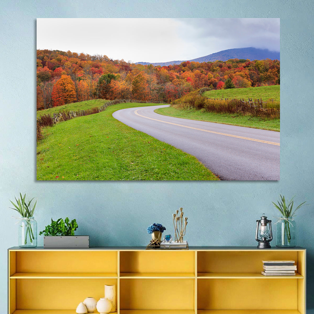 Curving Road Through Autumn Meadow Wall Art in a room, landscape