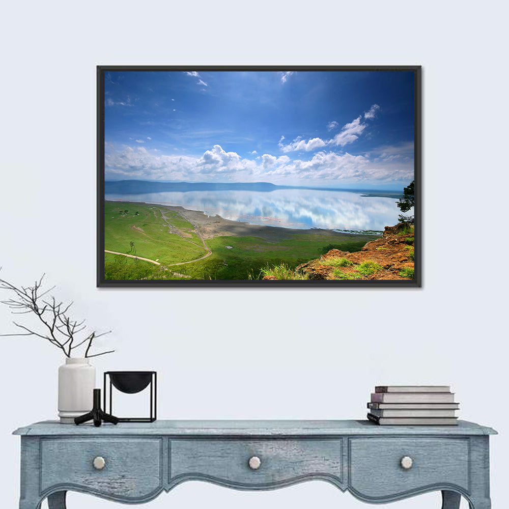 Lake Nakuru Cliffside Reflection Wall Art in a room, landscape