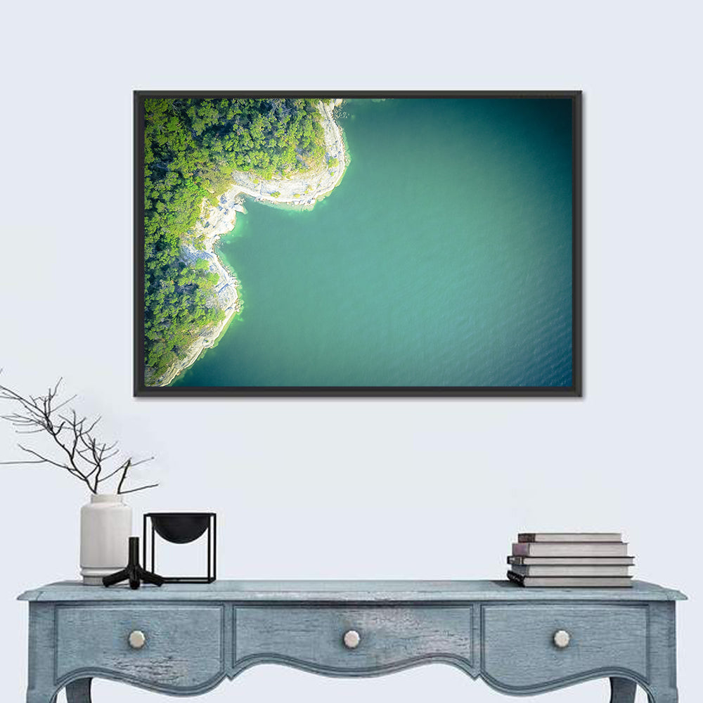 L-shaped Coastline Over Teal Lake Wall Art in a room, landscape