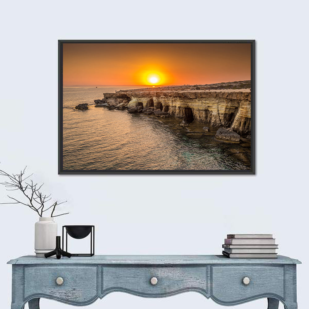Sunset Over Sea Caves Wall Art in a room, landscape