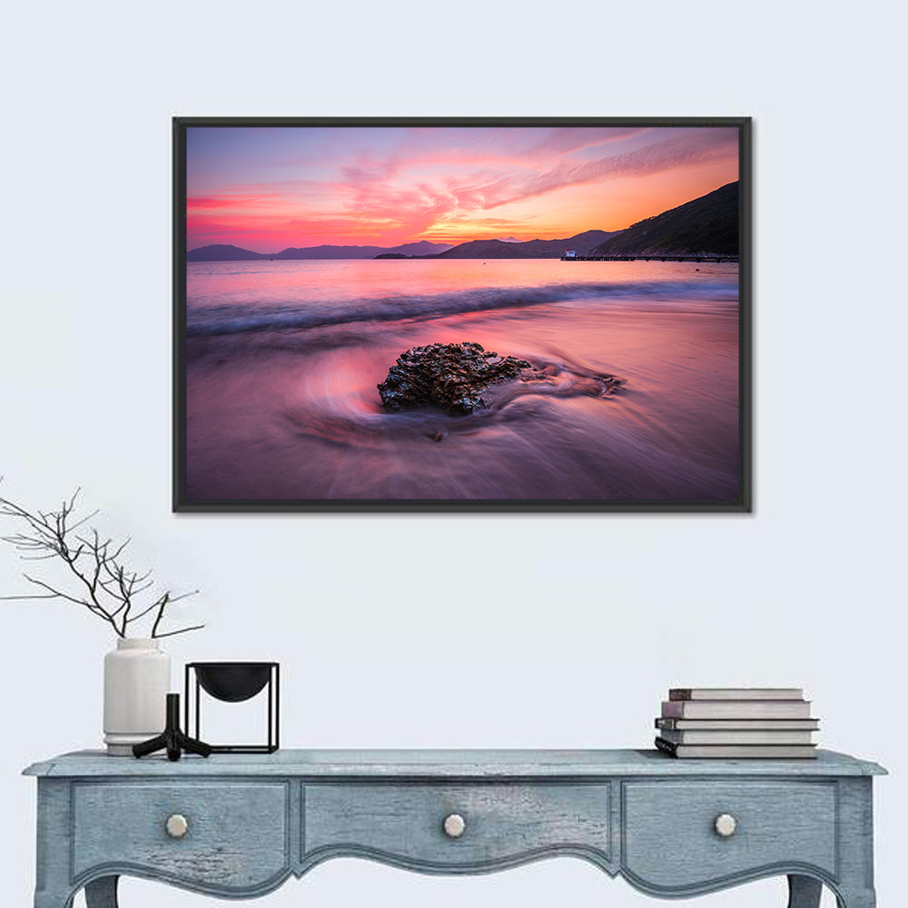 Pink Sunset Over Rock and Pier Wall Art in a room, landscape