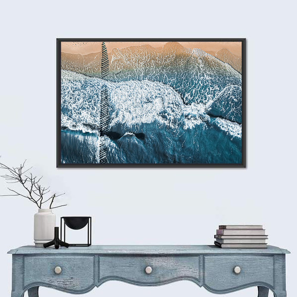 Aerial Pier Pilings Over Surf Wall Art in a room, landscape