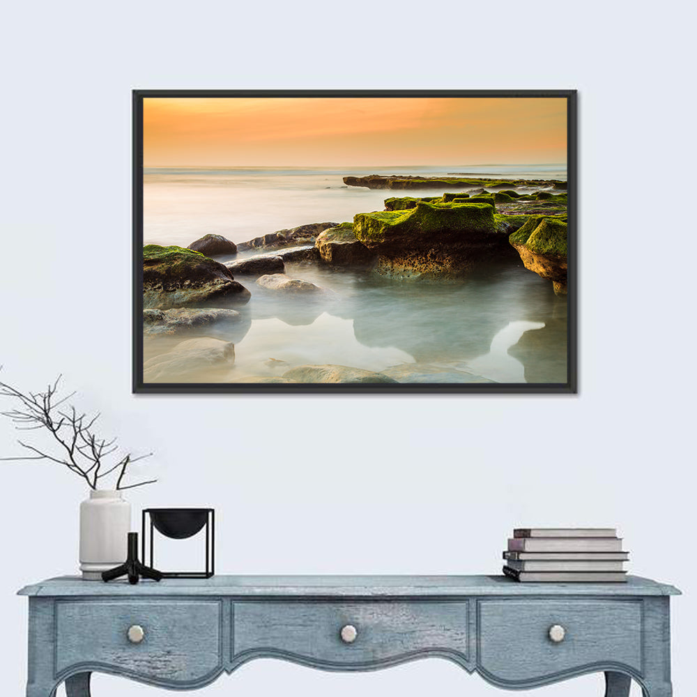 Mossy Rocky Coastline at Golden Hour Wall Art in a room, landscape