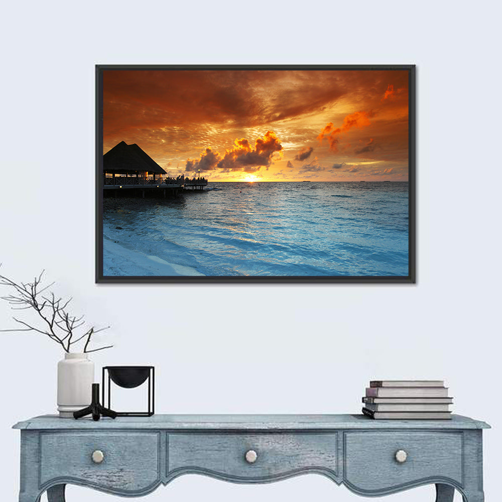 Overwater Bungalow Sunset Pier Wall Art in a room, landscape