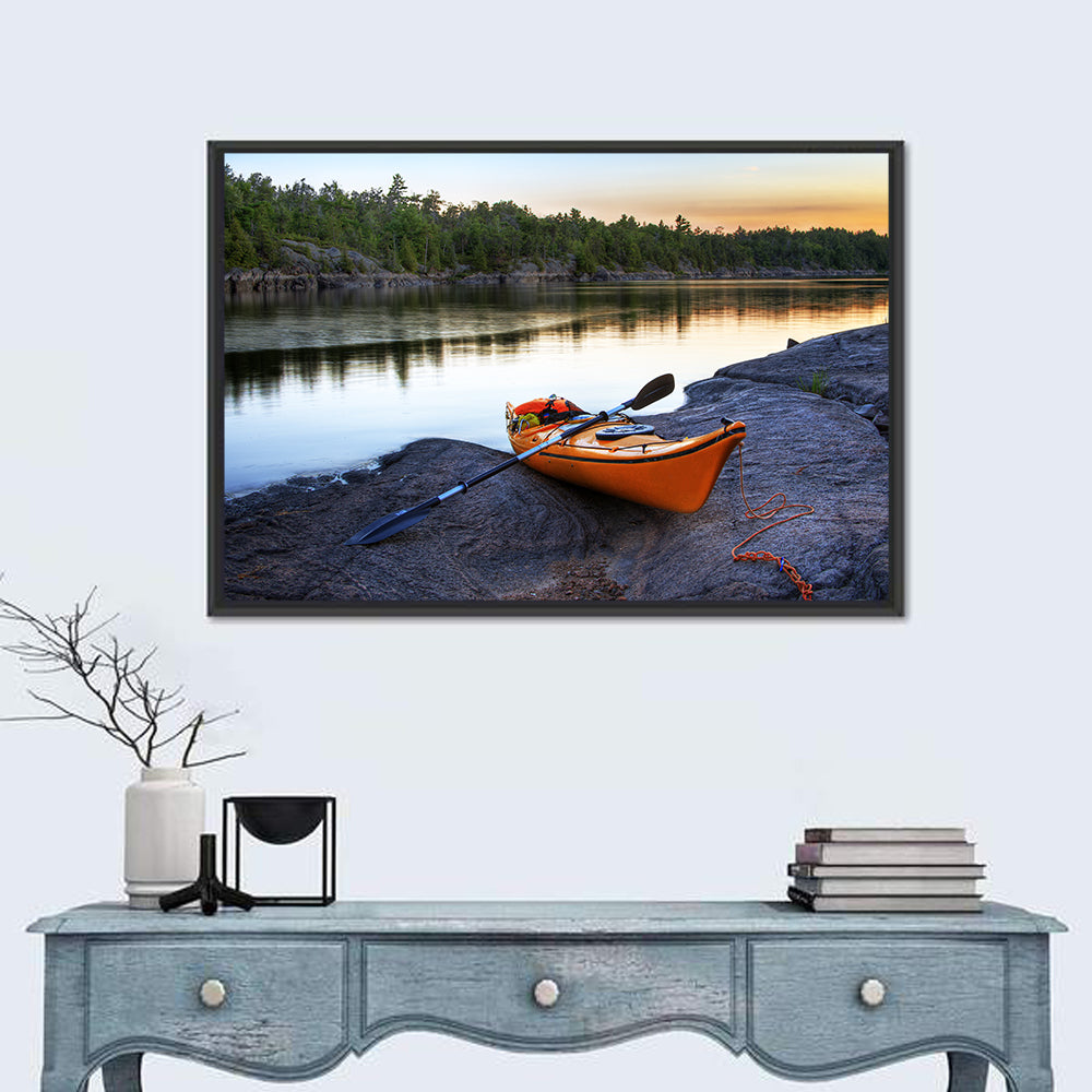 Orange Kayak on Rocky Shore Wall Art in a room, landscape