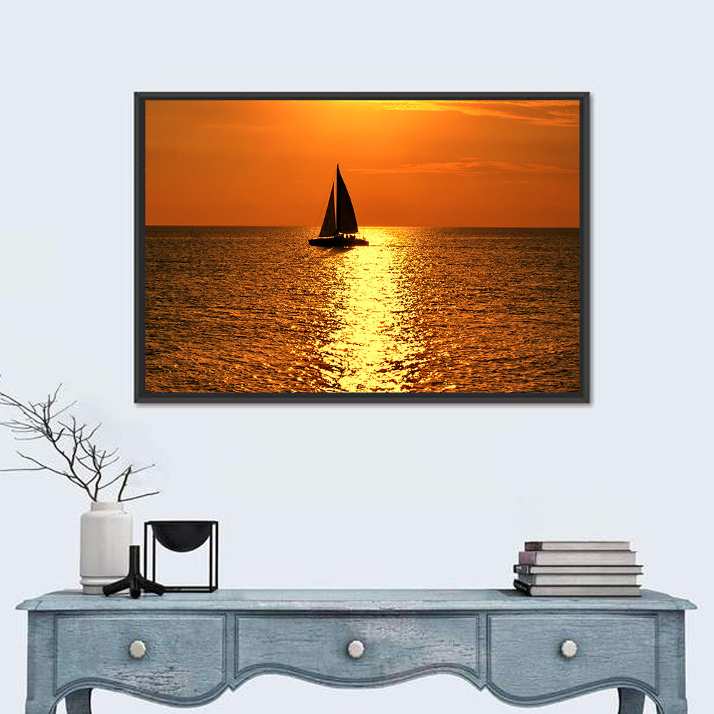 Sailboat Silhouette at Golden Sunset Wall Art in a room, landscape