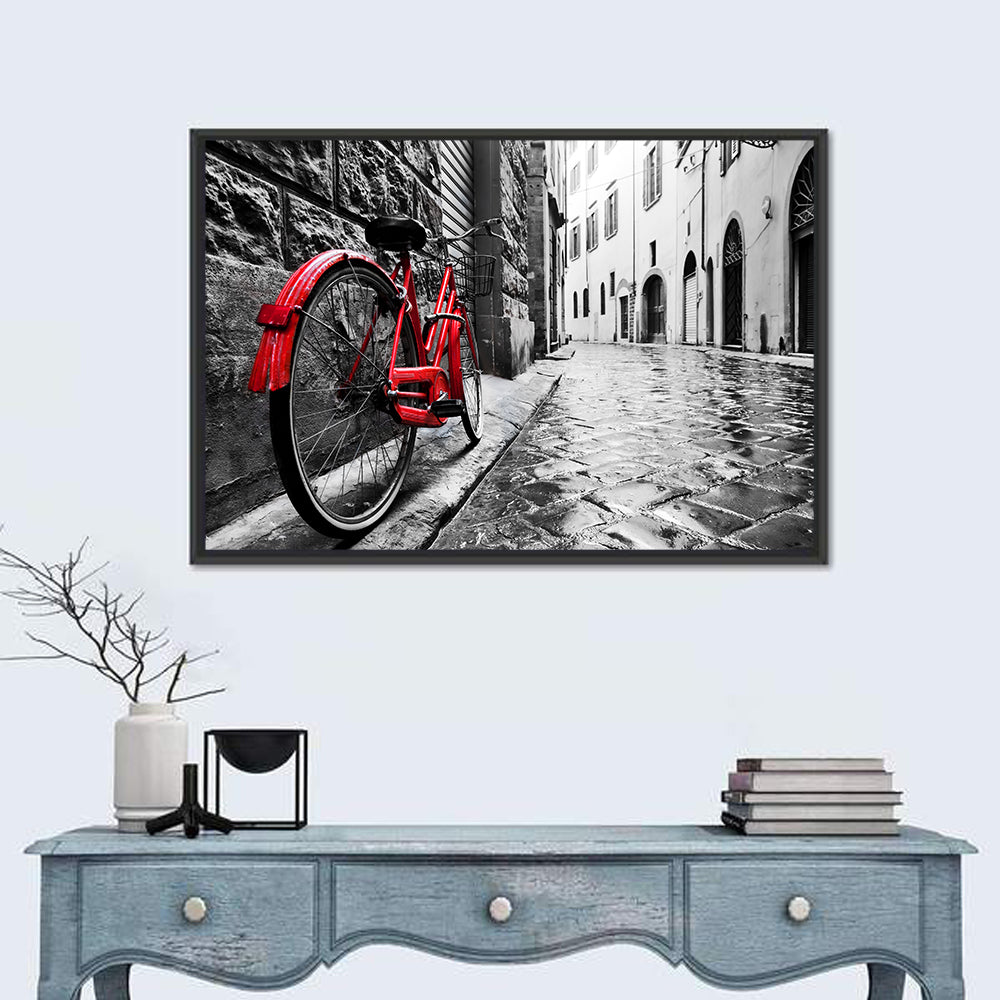 Red Bicycle on Rainy Cobblestone Street Wall Art