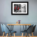 Red Bicycle on Rainy Cobblestone Street Wall Art