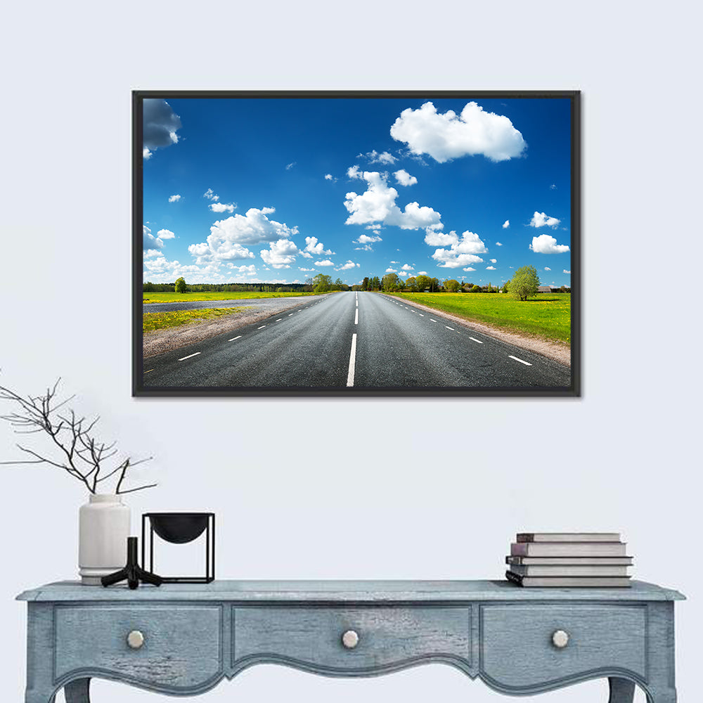 Asphalt Road Through Meadow Wall Art in a room, landscape