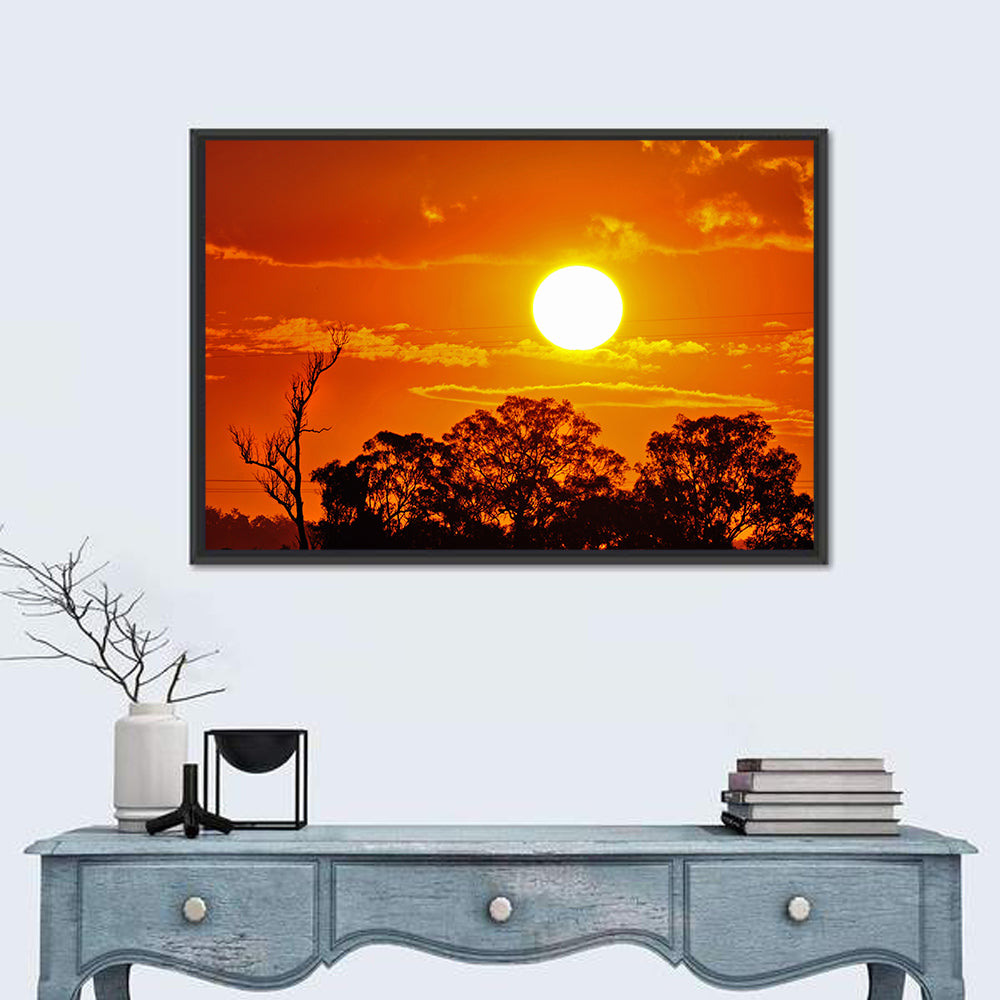 Burning Sun Over Tree Silhouettes Wall Art in a room, landscape