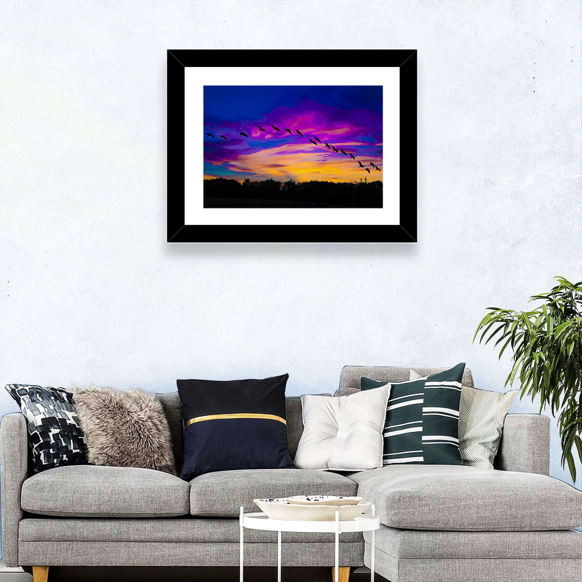 Silhouetted Cranes at Dusk Wall Art in a room, landscape
