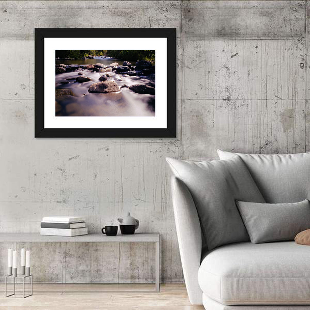Truckee River Sunlit Rocks Wall Art in a room, landscape